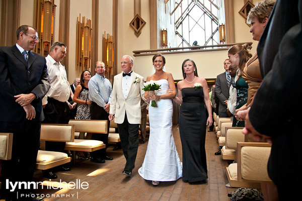 bride escorted by both parents down aisle, fort worth