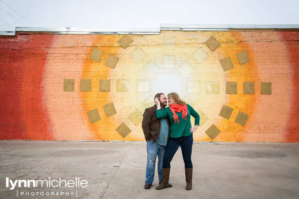 engagement portraits rainbow wall