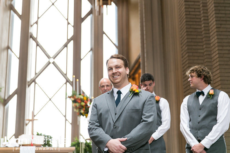 groom first look at Marty Leonard Chapel