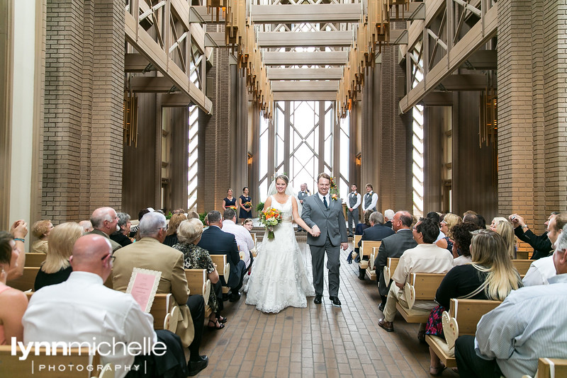 bride and groom exit at fort worth chapel marty leonad