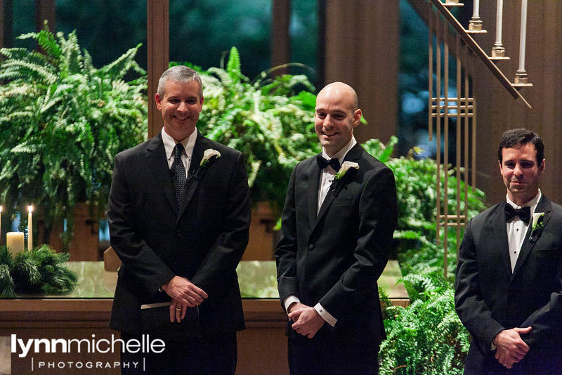 groom's first look at Marty Leonard Chapel in the evening