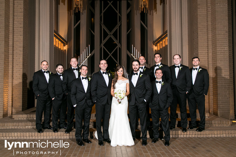 bride and groomsmen on altar at modern chapel