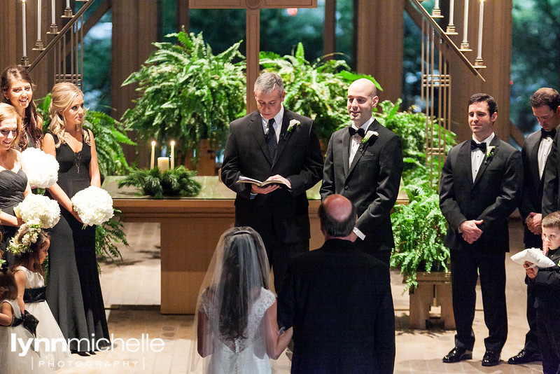 bride and father at altar at Marty Leonard Chapel in the evening