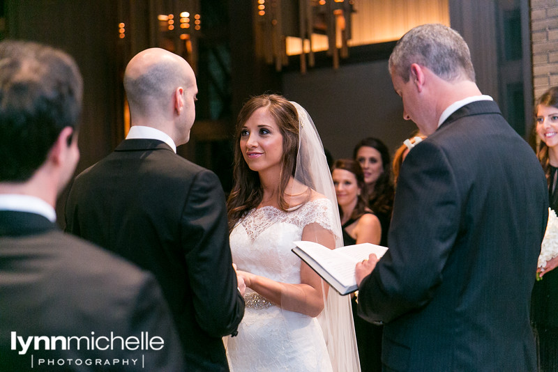 bride and groom on altar at  Marty Leonard Chapel 