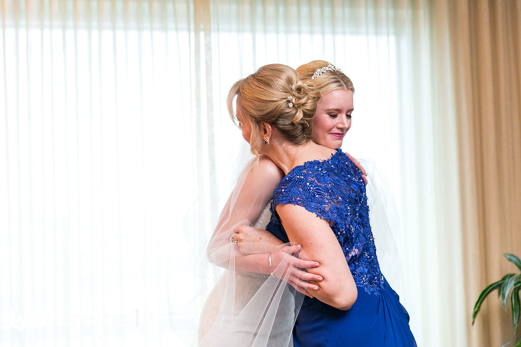 bride and mom getting ready wedding day