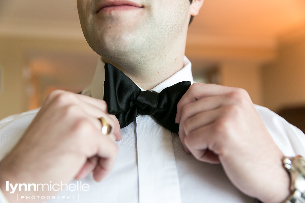 black tie groom getting ready