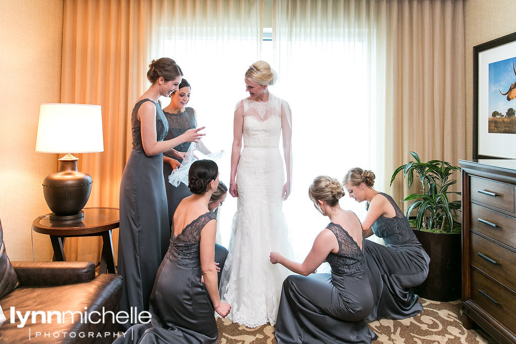 bride and bridesmaids gtting ready on wedding day.