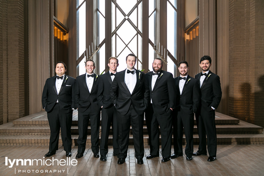 groom and groomsmen inside fort worth chapel