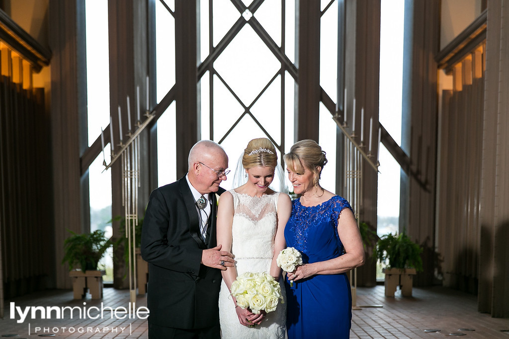 bride and parents inside chapel