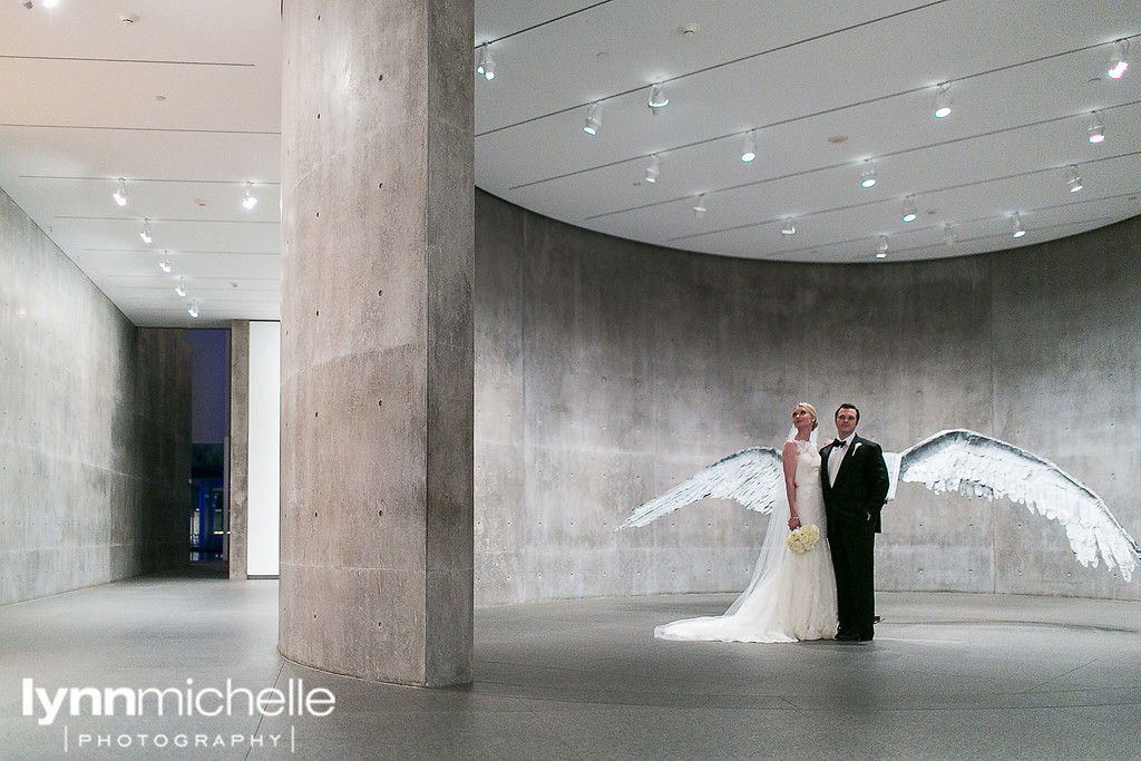 the modern museum of art portrais of bride and groom wings