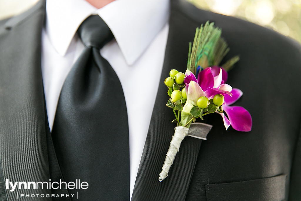 groom's boutineer flowers peacock